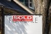 Sold over asking real estate sign and home prices