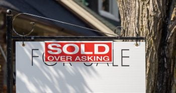 Sold over asking real estate sign and home prices